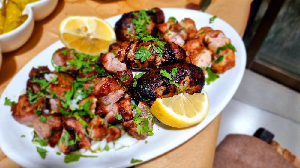 Charcoal-grilled kebabs and sheftalia at Geitonia Traditional Kebab House